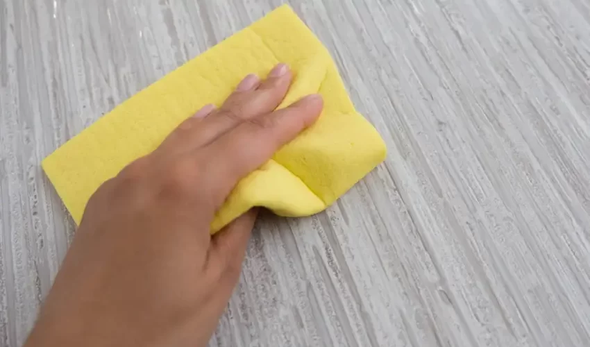 a gentle rub to get dried paint of laminate floor